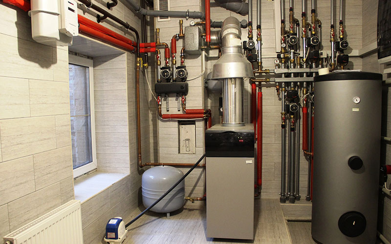 House boiler, water heater, expansion tank and other pipes. new modern independent heating system in boiler room, gas