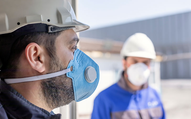 The workers are using personal protective equipments. For healthcare professionals caring for people with covid-19, the CDC recommends placing the person in an airborne infection isolation room.
