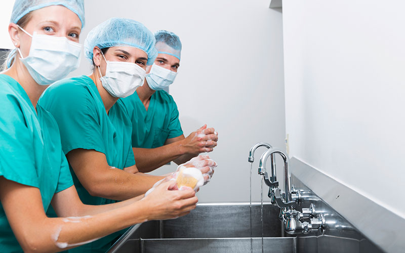 Doctors washing hands before surgery. Blog thumb